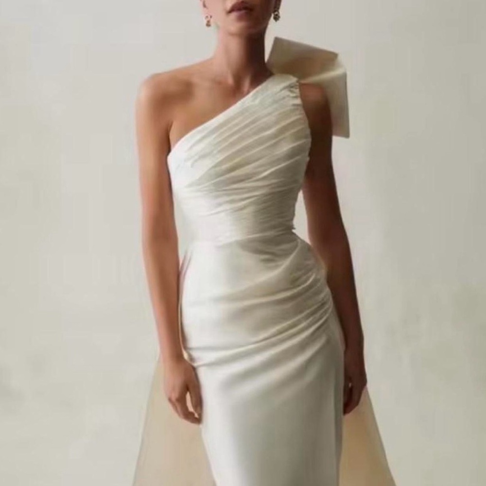 Elegant One-Shoulder White Dress with Blue Bow